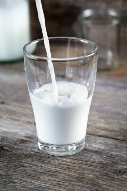 istock Pouring a glass of fresh milk 1322301512