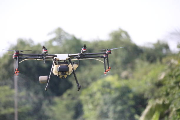 istock Drone spraying insecticide in flight. 1322301536