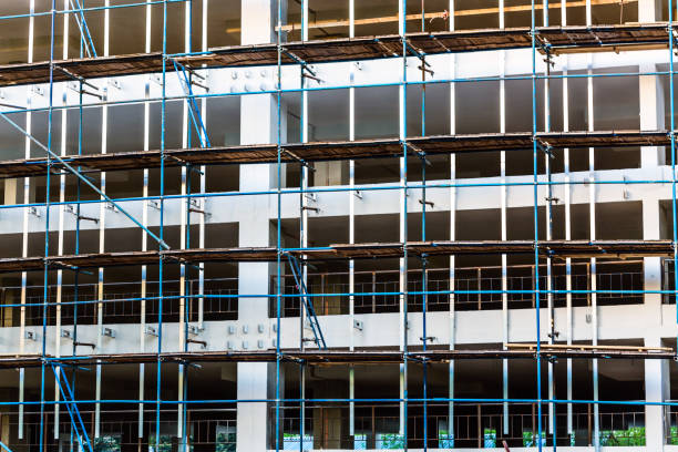 istock Building reconstruction concept. Scaffolding on a building 1322303658