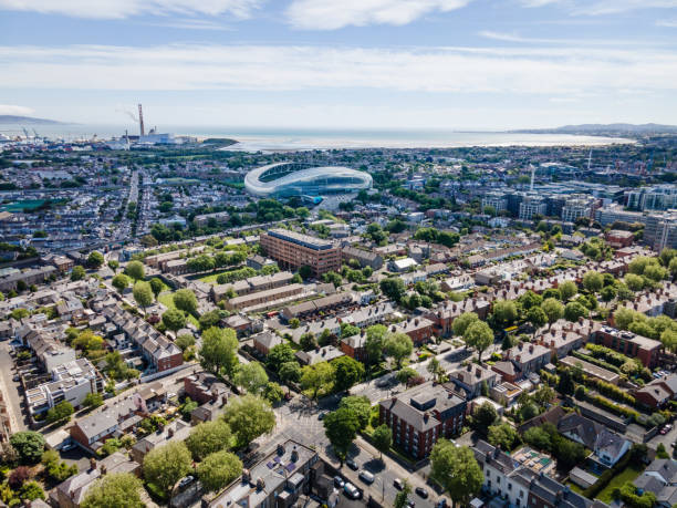 Drone aerial view of the streets of Dublin city and skyline on a bright summer sunny day, Dublin bay on the horizon, shot from Ballsbridge area
