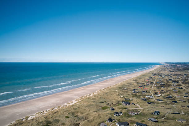 istock blue water on the beach in summer in denmark 1322306114