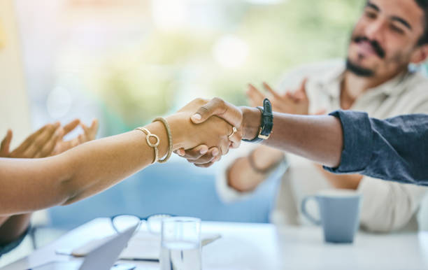 istock Shot of two unrecognizable business people shaking hands 1322306213