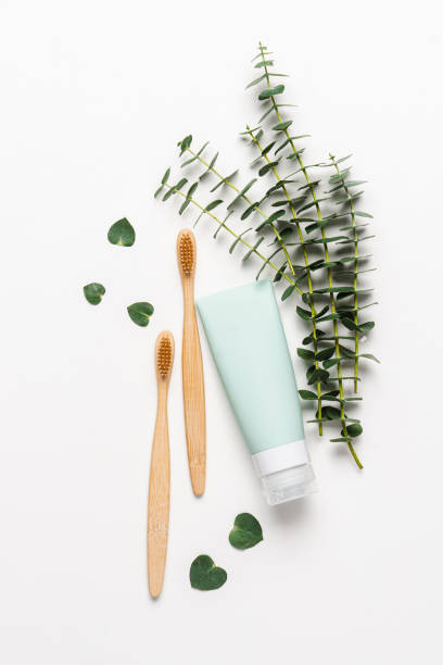 istock Bamboo toothbrushes and tubes of toothpaste 1322308295