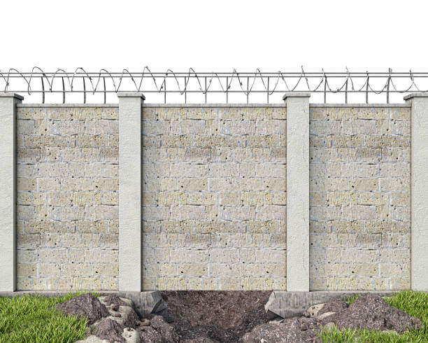 istock A hole dug up under the brickwall fence with barbed wire, front view, escape concept, 3d illustration 1322308313