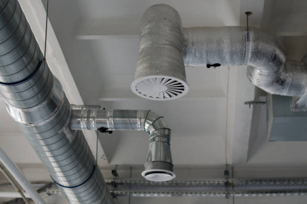 istock Air duct, air conditioner pipe and fire sprinkler system on white ceiling wall. Building interior. Air flow and ventilation system. Interior architecture concept. 1322309932