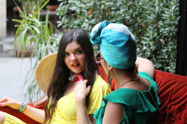 istock two young beautiful women chatting and having fun in cafe 1322309934