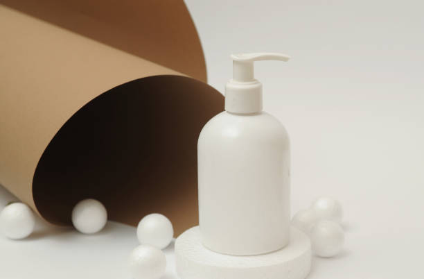 istock Light cosmetic bottles with lilac on background. 1322311155