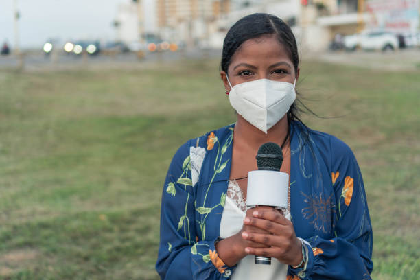 istock Female journalist wearing face mask 1322312694