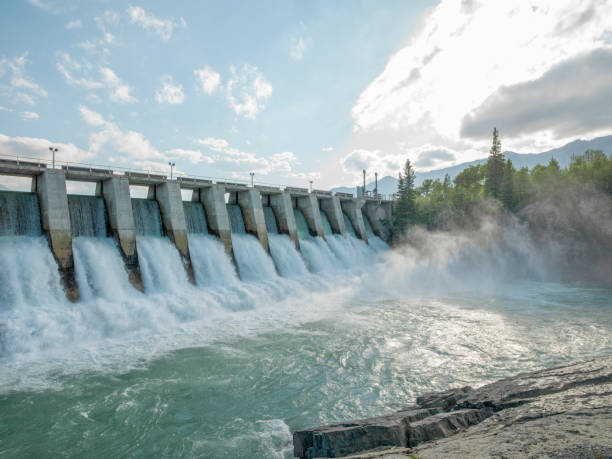 Water rushes through hydroelectric dam stock photo