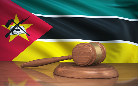 3d Render Judge Gavel and Mozambique flag on background (close-up)