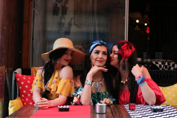 istock three young beautiful women chatting and having fun in cafe 1322322321
