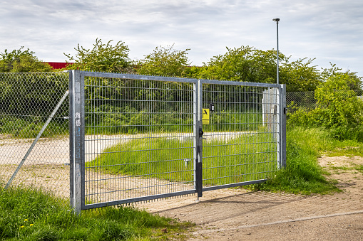 Modern stone fence with aluminum or metal Horizontal sections