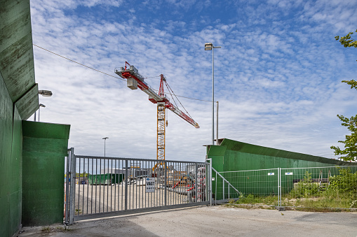 Crane and gate at a construction site in Valby, a suburb of Copenhagen