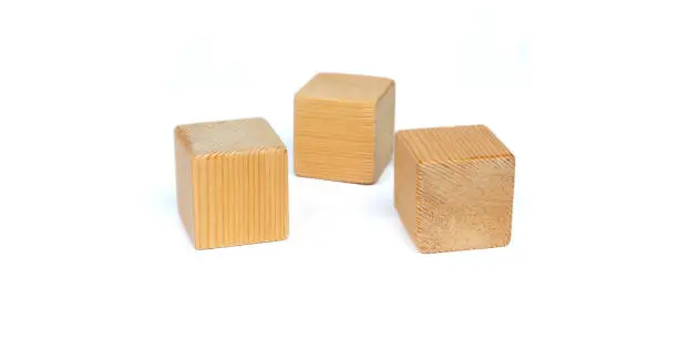3 natural blank wooden toy blocks on white background