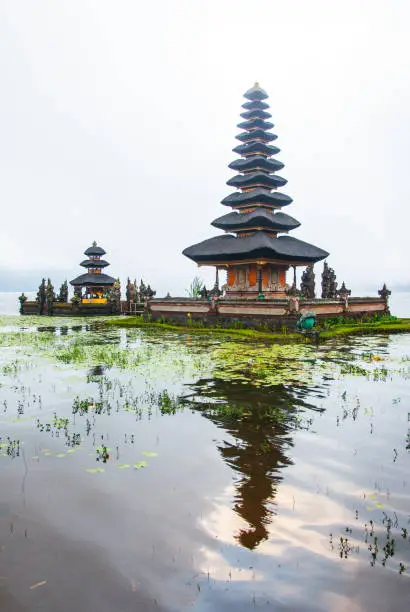 pura ulun danu bratan hindu temple on bratan lake in bali, cloudy rainy weather