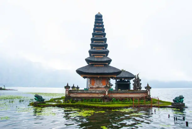 pura ulun danu bratan hindu temple on bratan lake in bali, cloudy rainy weather