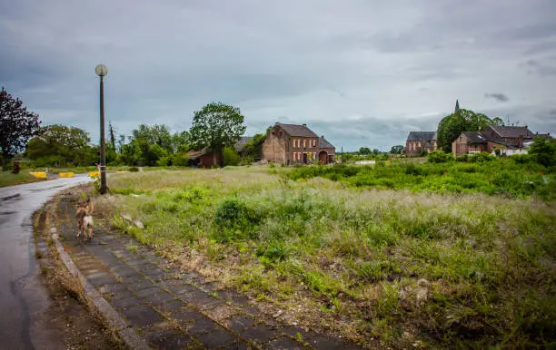 Empty streets and abandoned houses in the resettled village of Manheim - Alt for the Hambach opencast mine