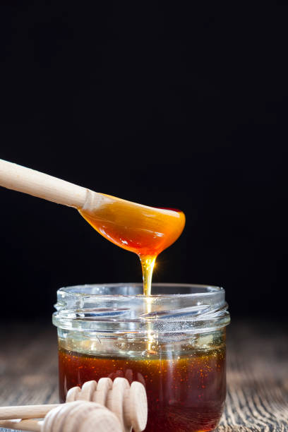 istock natural viscous honey, which is produced by honey bees 1322334292