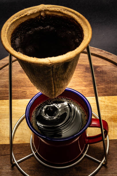 istock Coffee being strained in the strainer. 1322334971