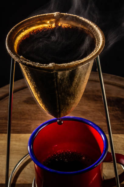 istock Coffee being strained in the strainer. 1322335275