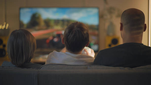 istock Screen time during pandemic. Father and sons playing video games 1322336404