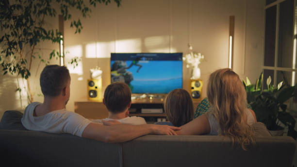 istock Watching tv at home. Family with two sons spending time together 1322336564