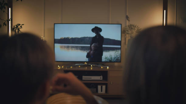istock Watching tv at home. Brothers spending time together 1322336630