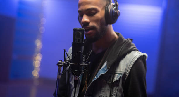 istock African American Musician Recording His Singing In Recording Studio 1322337721