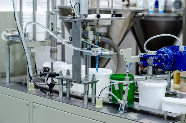 istock Automatic line filling and seaming and packing products into plastic buckets 1322338386