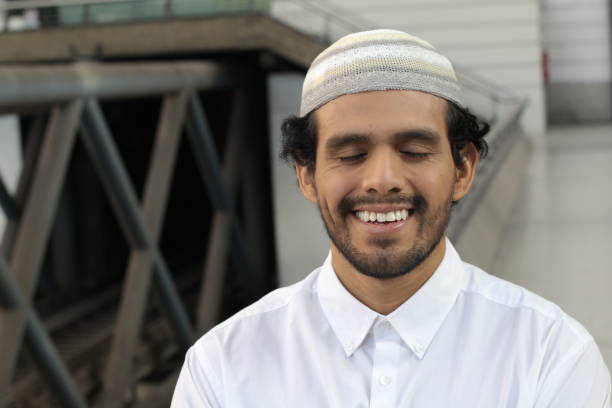 istock Trustful Islamic man smiling with eyes closed 1322340110