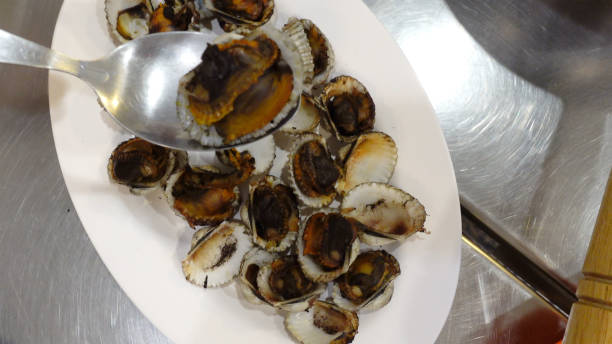 istock Thai style blood clam bbq grilling top view 1322342456