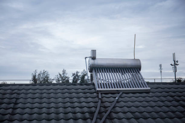 Photo of solar powered water tank heater on the rooftop A Photo of solar powered water tank heater on the rooftop solar heater stock pictures, royalty-free photos & images