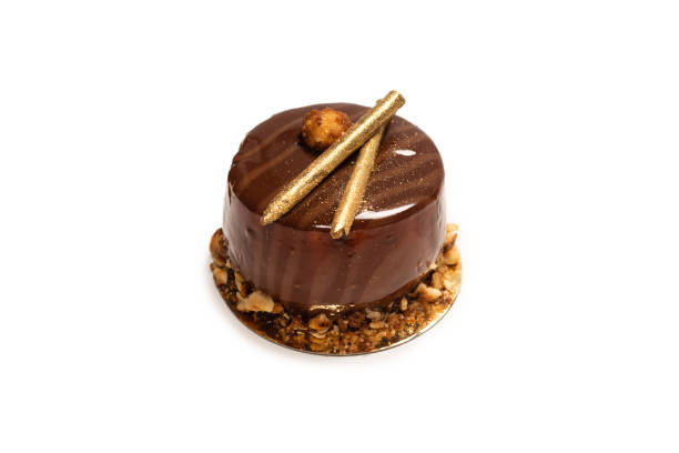 istock Chocolate and caramel cake isolated on a white background. 1322344436