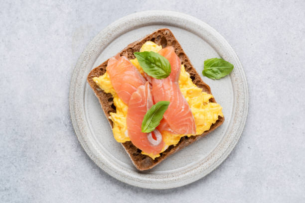 istock Breakfast toast with scrambled eggs and smoked salmon Lox 1322349281