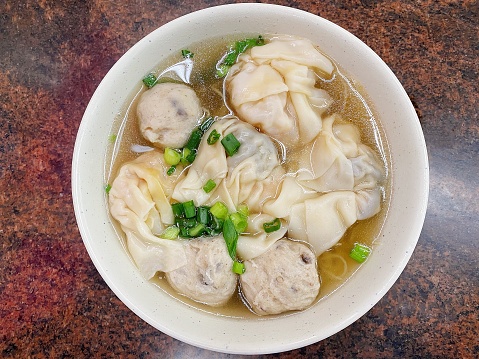 Cantonese style food dumplings with noodles soup