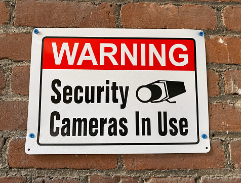 Warning Security Cameras in Use sign.
