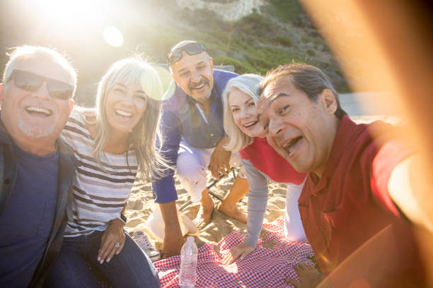 istock Senior Friends Taking Selfie at Picnic 1322352785