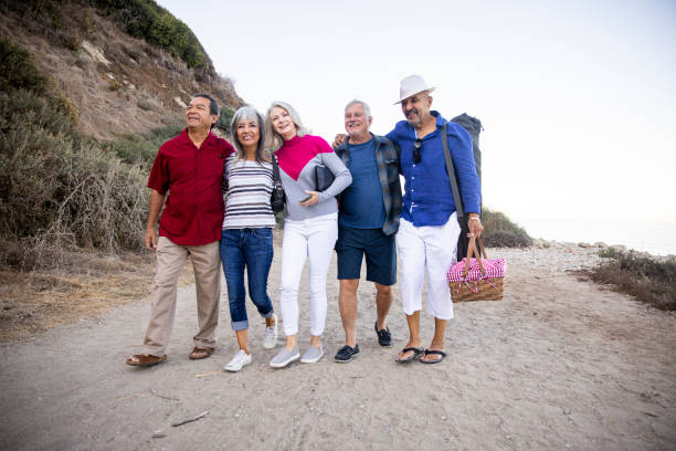 istock Senior Friends Going to the Beach 1322352874