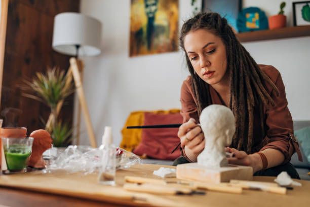 istock Her hobby, a sculpting is also her passion and she is really dedicated to it 1322355395