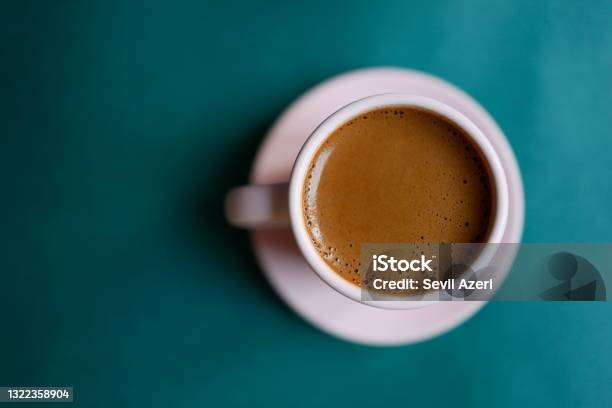 Turkish Coffee With Plenty Of Foam In A Powder Pink Cup On A Dark Turquoise Green Background Teal Background Closeup Stock Photo - Download Image Now