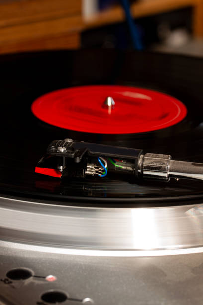 istock Record usb player turntable with its stylus running on record. 1322359524