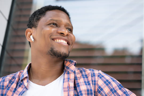 istock African american man sitting at a store window. 1322360413