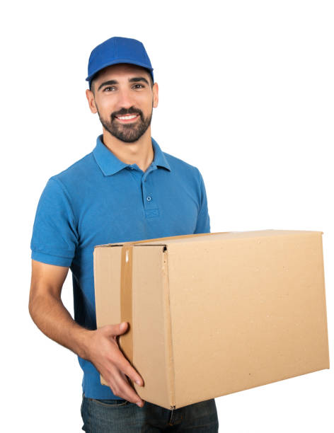 istock Delivery man holding cardboard boxes. 1322360642