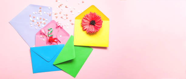 istock Abstract pink background with colorful envelopes. Festive concept or Romantic Love message.  Creative copy space 1322362390