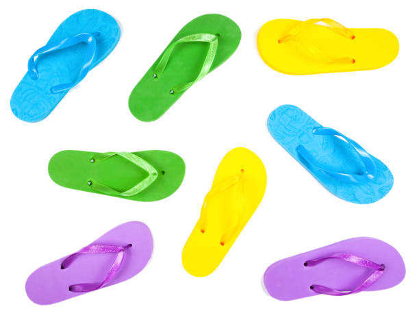 istock rubber flip flops of different colors on a white background, view from above, isolate 1322362628