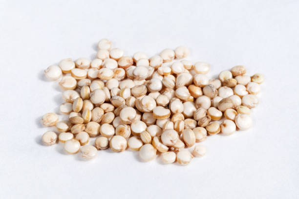 istock Uncooked quinoa macro image close-up. isolated on a white background 1322362851