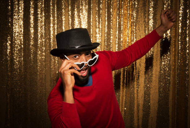 istock Man wearing funny props and enjoying party 1322368725