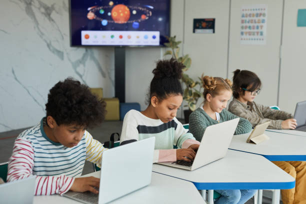 istock Group of Children Studying IT in Class 1322369820