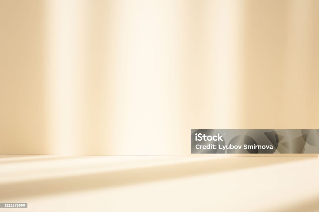 Abstract pastel yellow studio background for product presentation. Empty room with shadows of window. Display product with blurred backdrop. Backgrounds Stock Photo