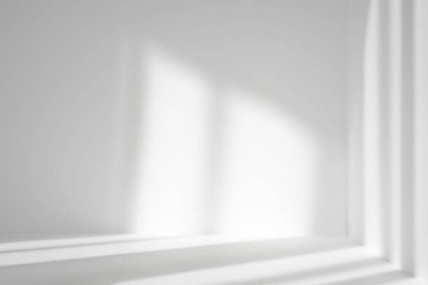 istock Empty white corner. Abstract studio background for product presentation. 3d room with shadows of window. Minimalistic space concept with blurred backdrop. 1322376035